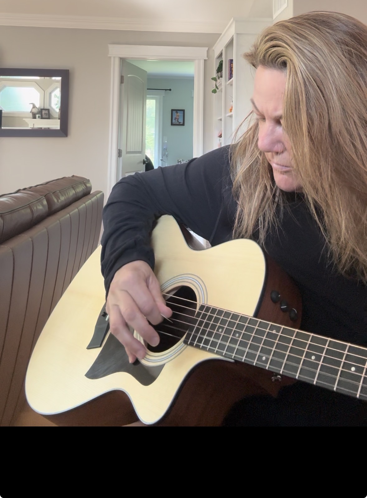 Sandra playing guitar